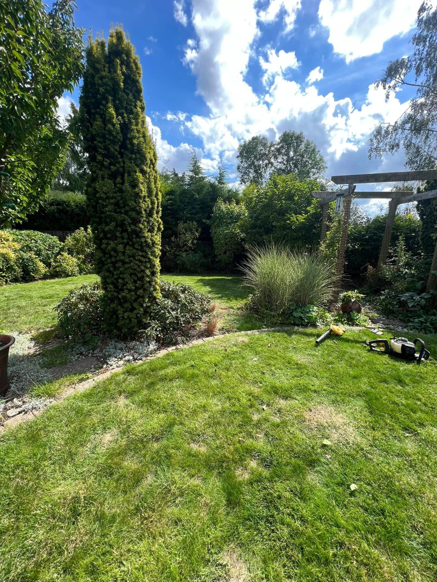 Freshly maintained lawn and borders at a Northamptonshire property
